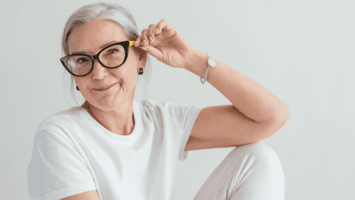 The Power Of Routine In Supporting Memory Loss In Golden, Co 4 A Senior Lady Holding Up Her Glasses While Smiling